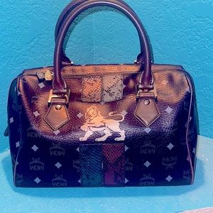 MCM Authentic Princess Lion doctor’s Black Coated Canvas bag.